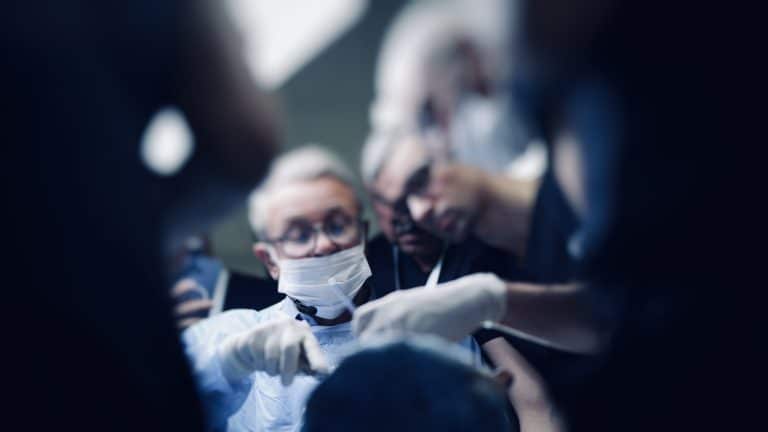 Surgeons practicing advanced techniques during a blepharoplasty training course