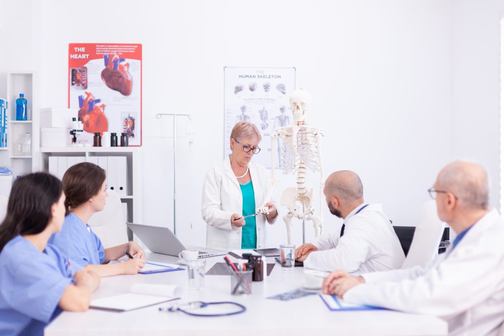 Orthopedic Training Program demonstrating on human skeleton model