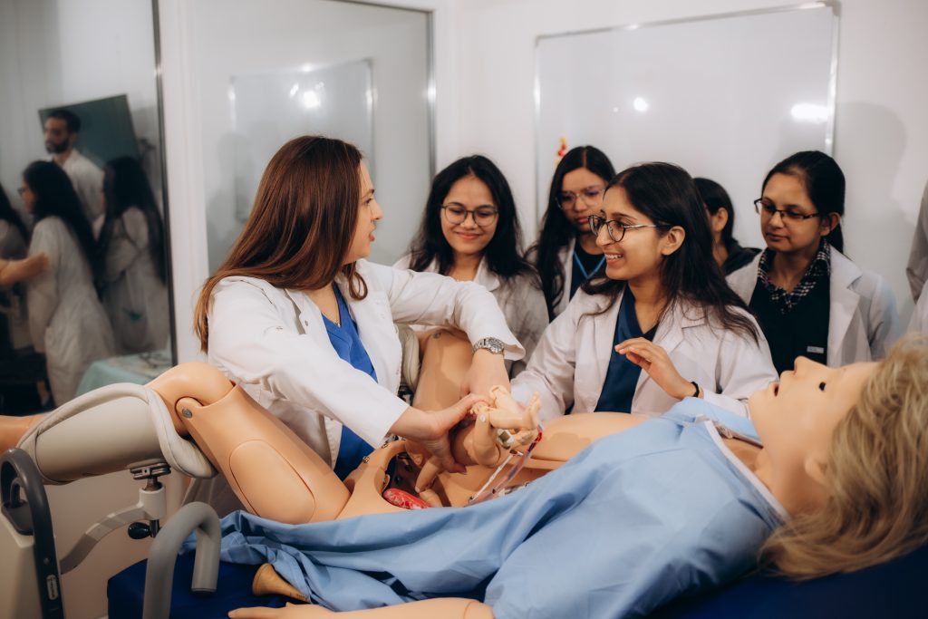 gynaecology students learn on a woman's dummy